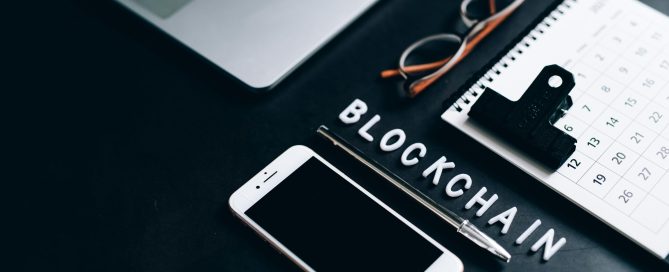 Free Flat lay of a modern digital workspace with blockchain theme, featuring a smartphone and calendar. Stock Photo