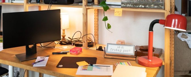 Tidy office desk with an organized laptop and folders
